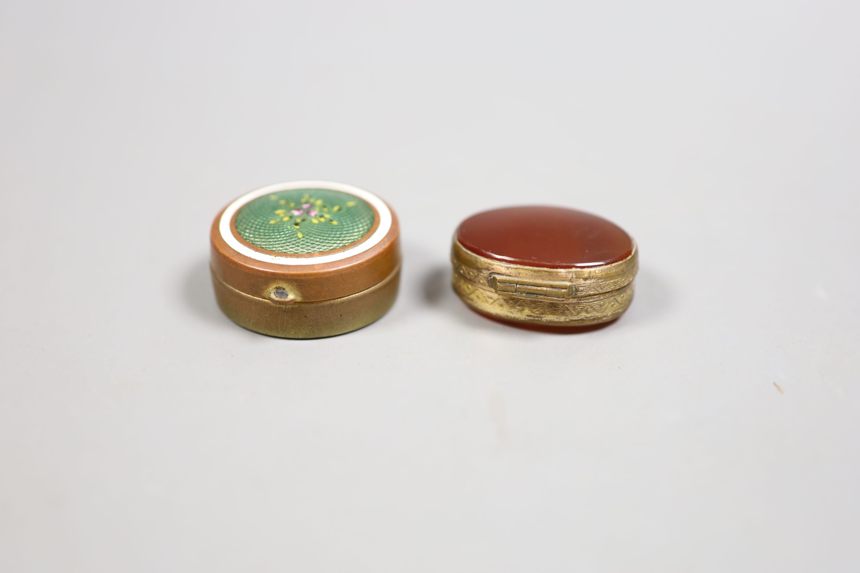 A George III silver curved snuff box, Birmingham, 1813, 52mm, a silver vesta case and two metal pill boxes